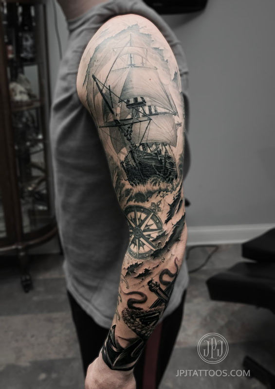 Nautical Arm Sleeve Tattoo foreground focus photo