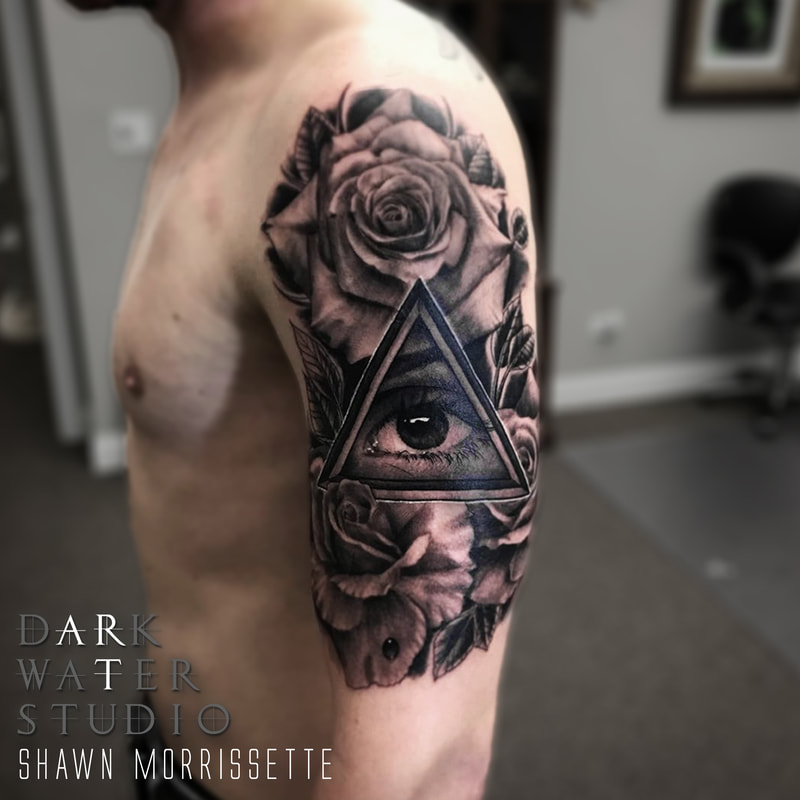 Eye and Rose Tattoo Foreground Focus Photo